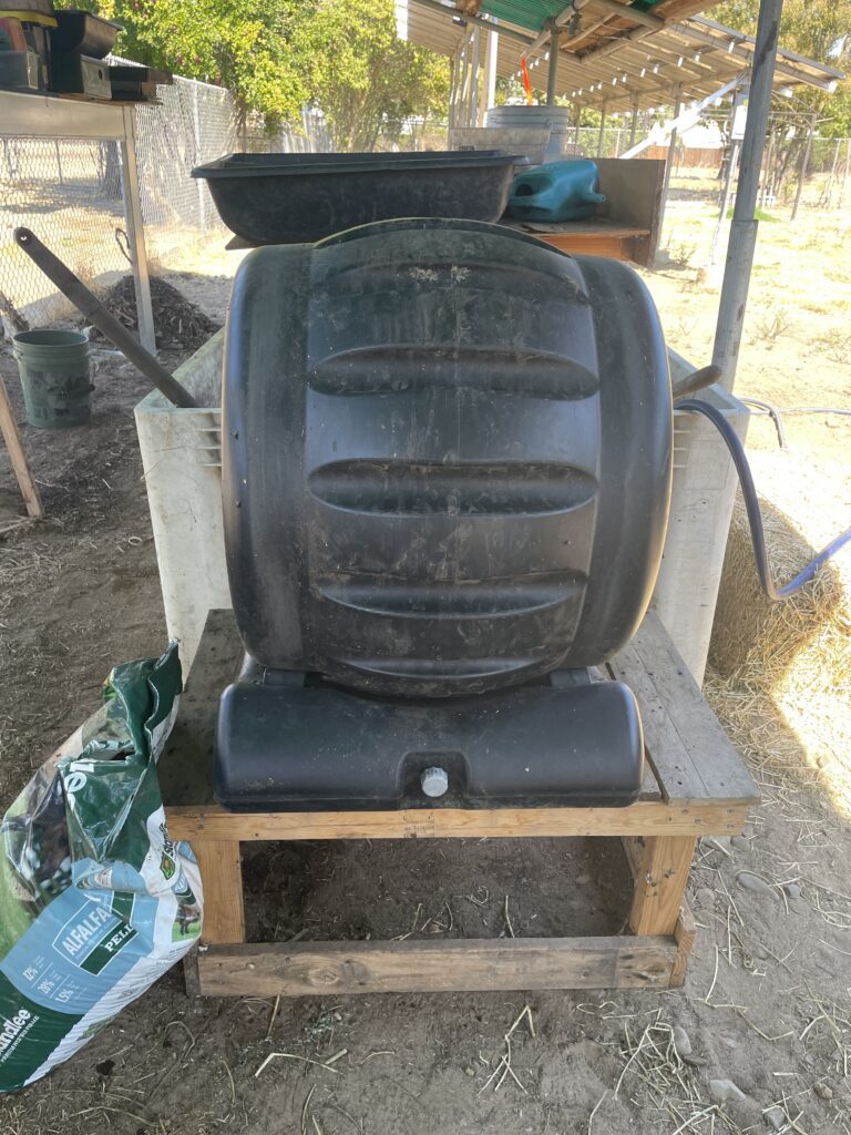 Compost tumbler used to pre-compost food scraps and organic materials for worm food